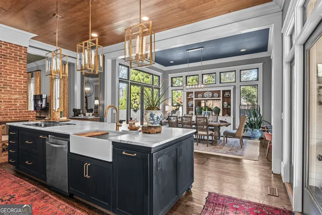 a kitchen with granite countertop a stove and a microwave
