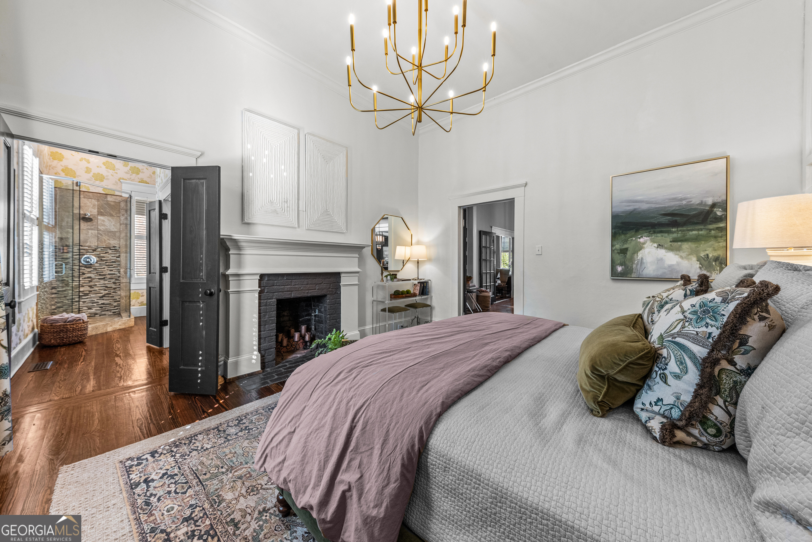 668 North Main Street Madison, GA 30650 - Photo 33 of 88 a bedroom with a bed and a fireplace