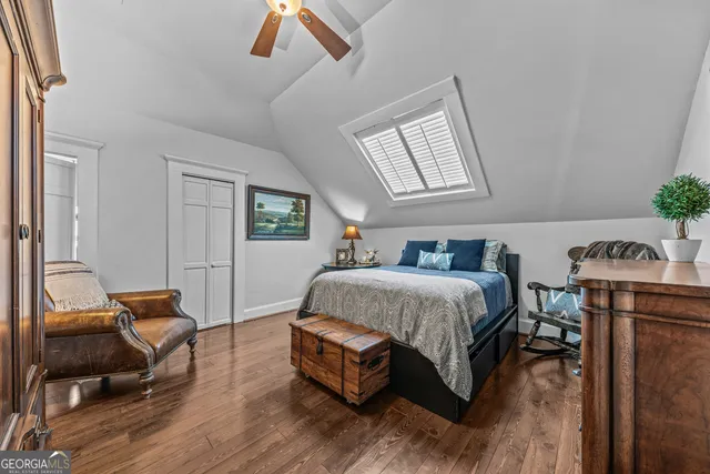 a balcony with furniture and a potted plant