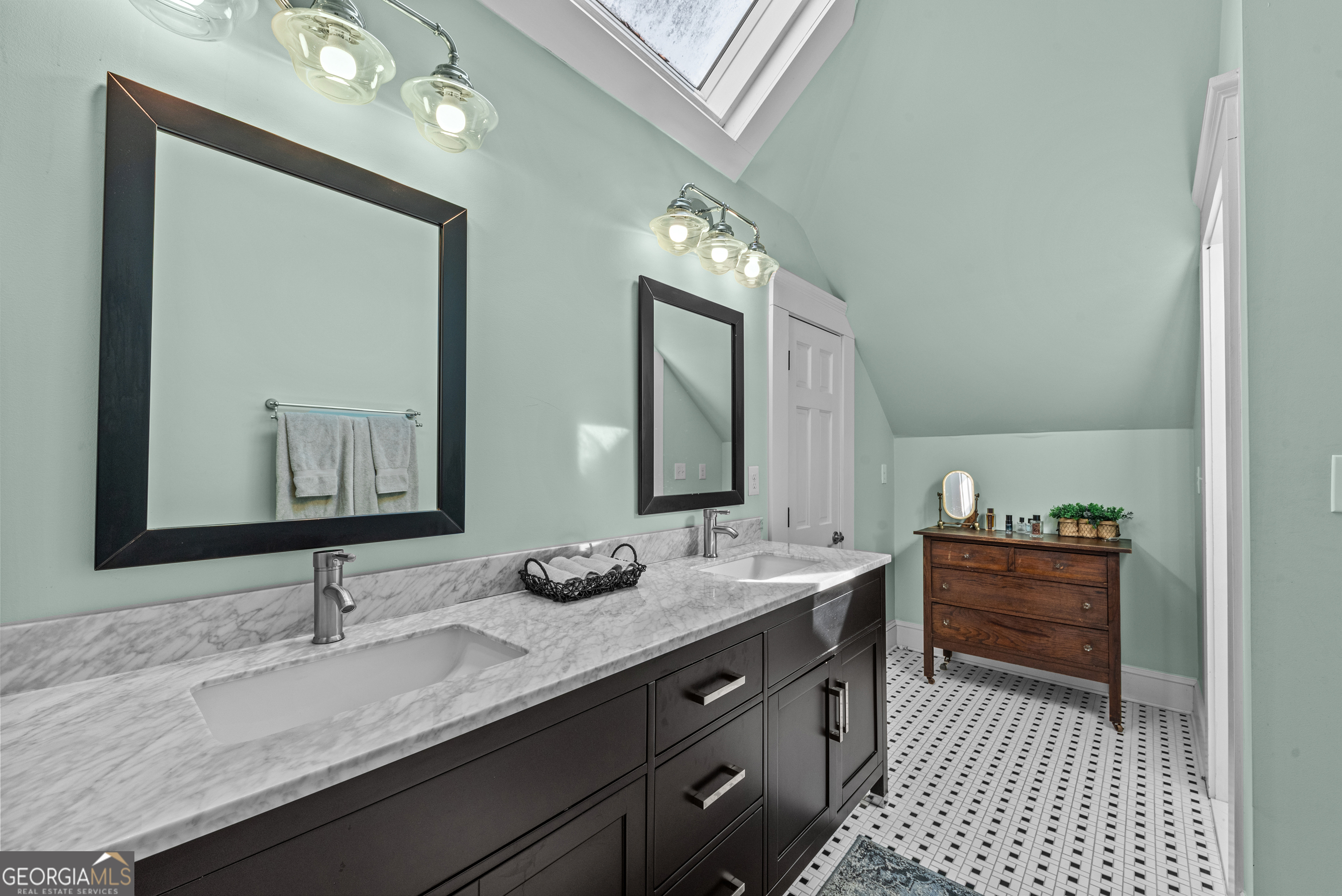 668 North Main Street Madison, GA 30650 - Photo 54 of 88 a bathroom with a sink and a mirror