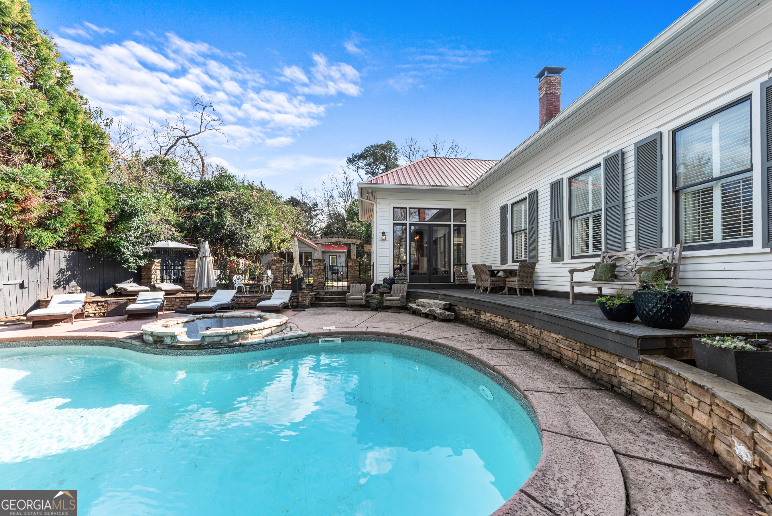 668 North Main Street Madison, GA 30650 - Photo 66 of 88 a view of a house with swimming pool and sitting area