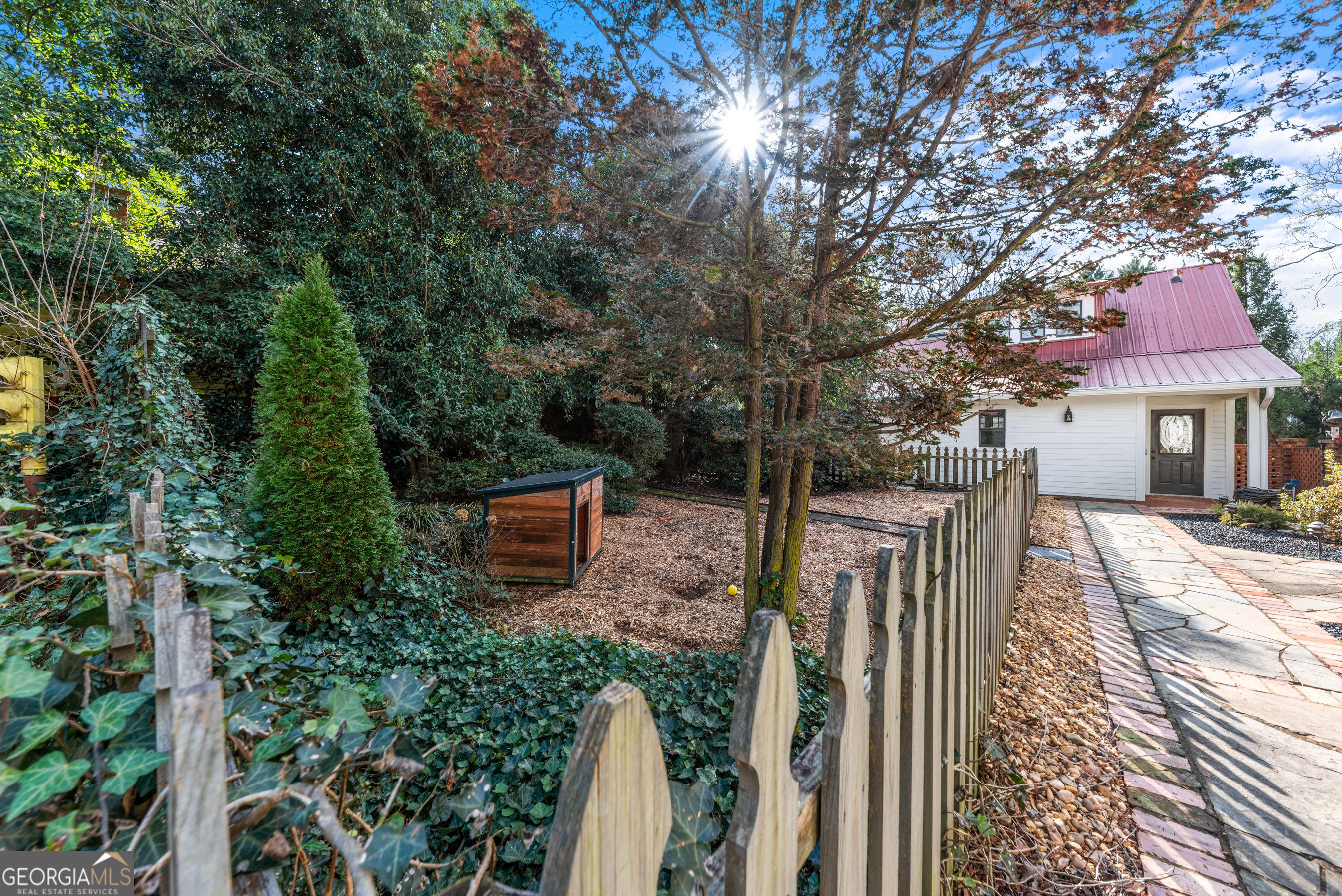 668 North Main Street Madison, GA 30650 - Photo 72 of 88 a view of a house with backyard and sitting area