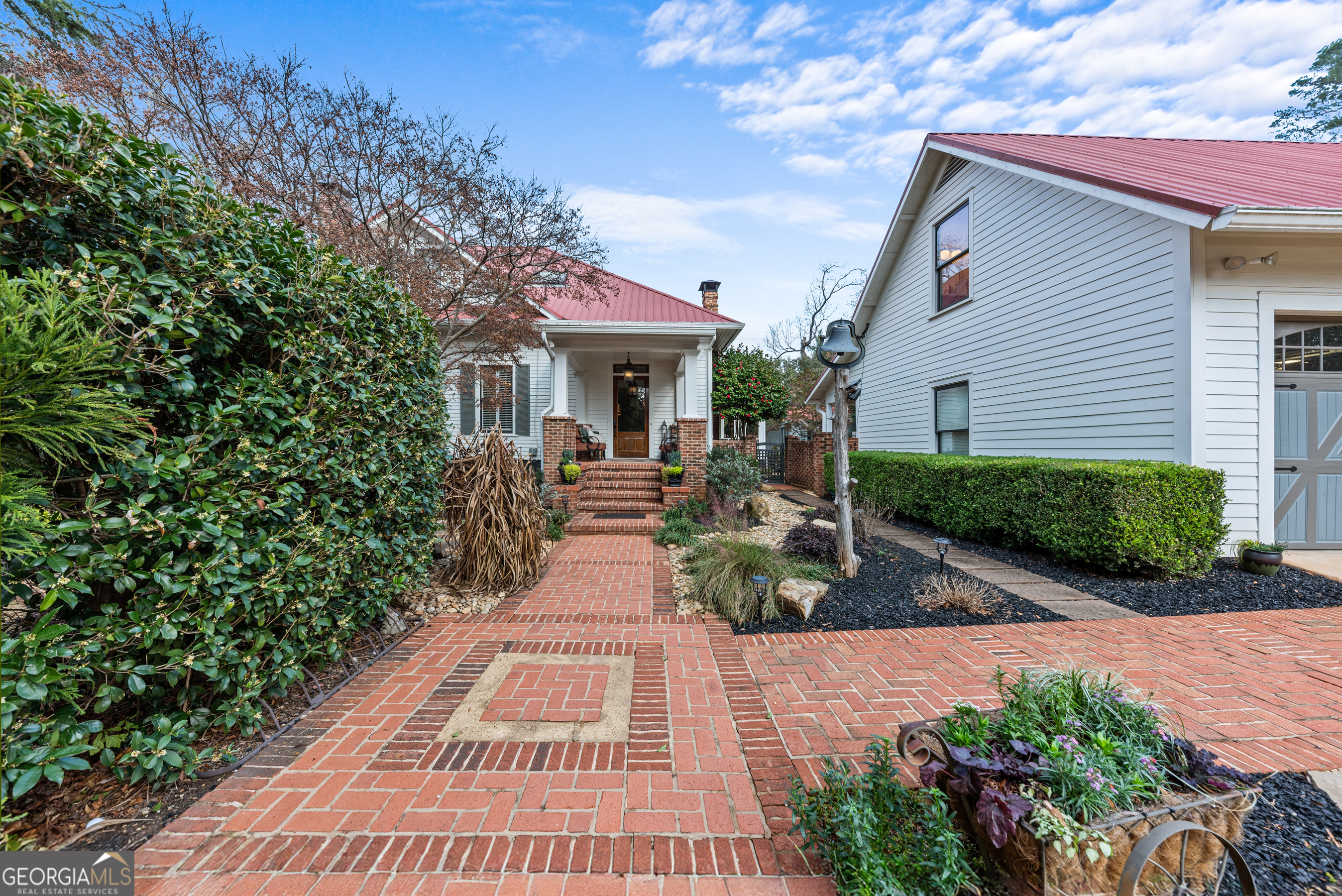 668 North Main Street Madison, GA 30650 - Photo 79 of 88 a view of a house with potted plants