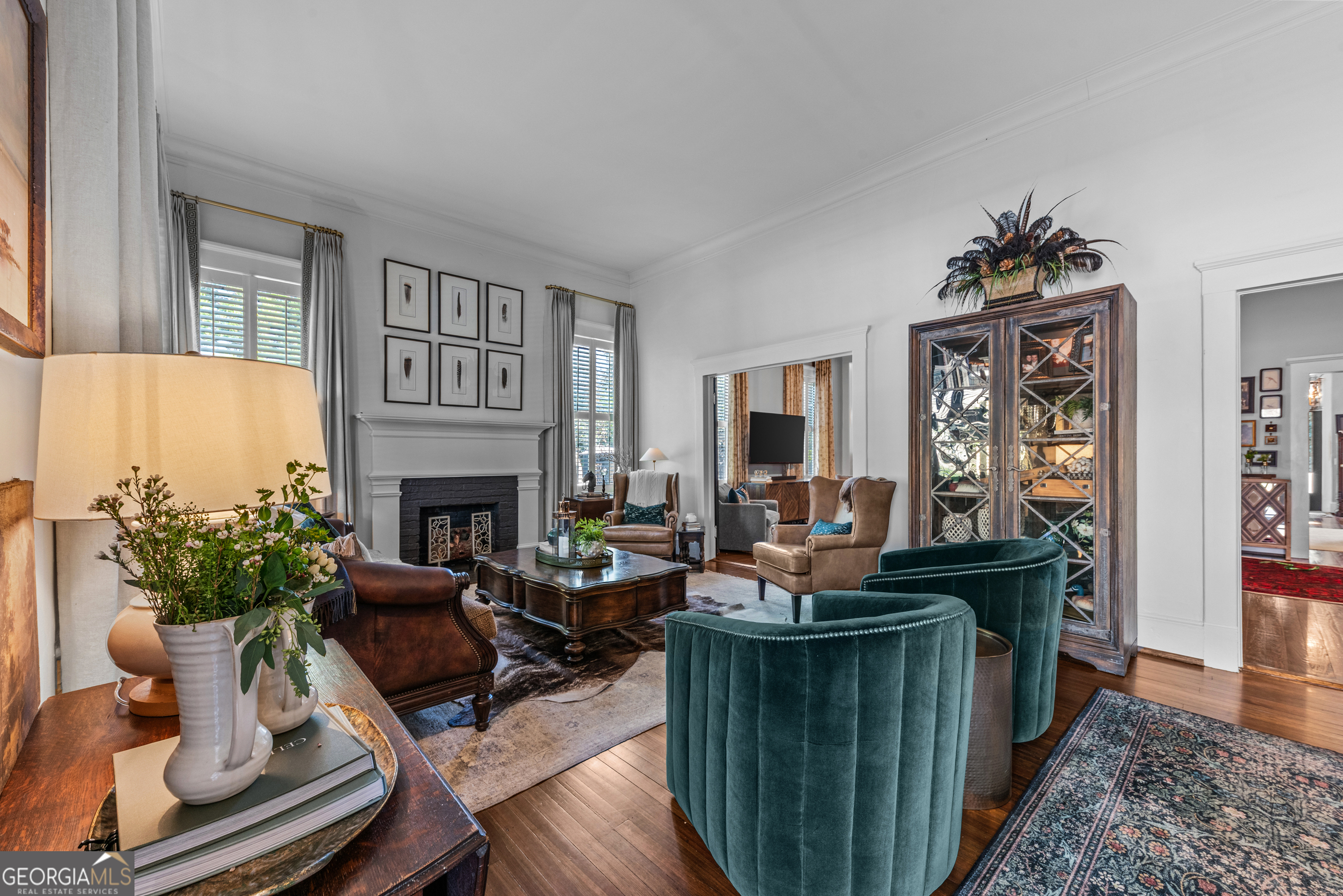 668 North Main Street Madison, GA 30650 - Photo 9 of 88 a living room with furniture and a fireplace