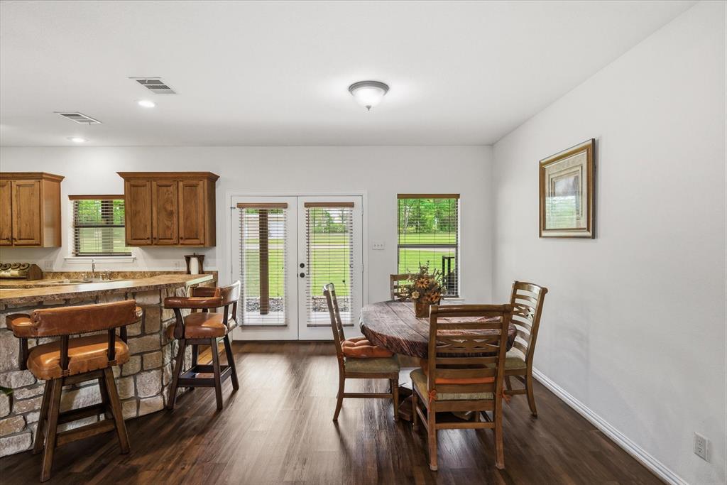 167 County Road 4202 Canton, TX 75103 - Photo 14 of 40 a view of a dining room with furniture and wooden floor