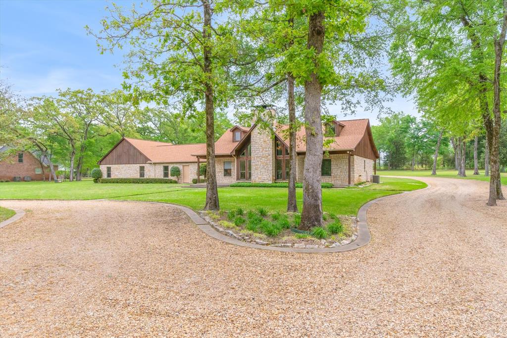 167 County Road 4202 Canton, TX 75103 - Photo 5 of 40 a view of a house with a big yard and large trees