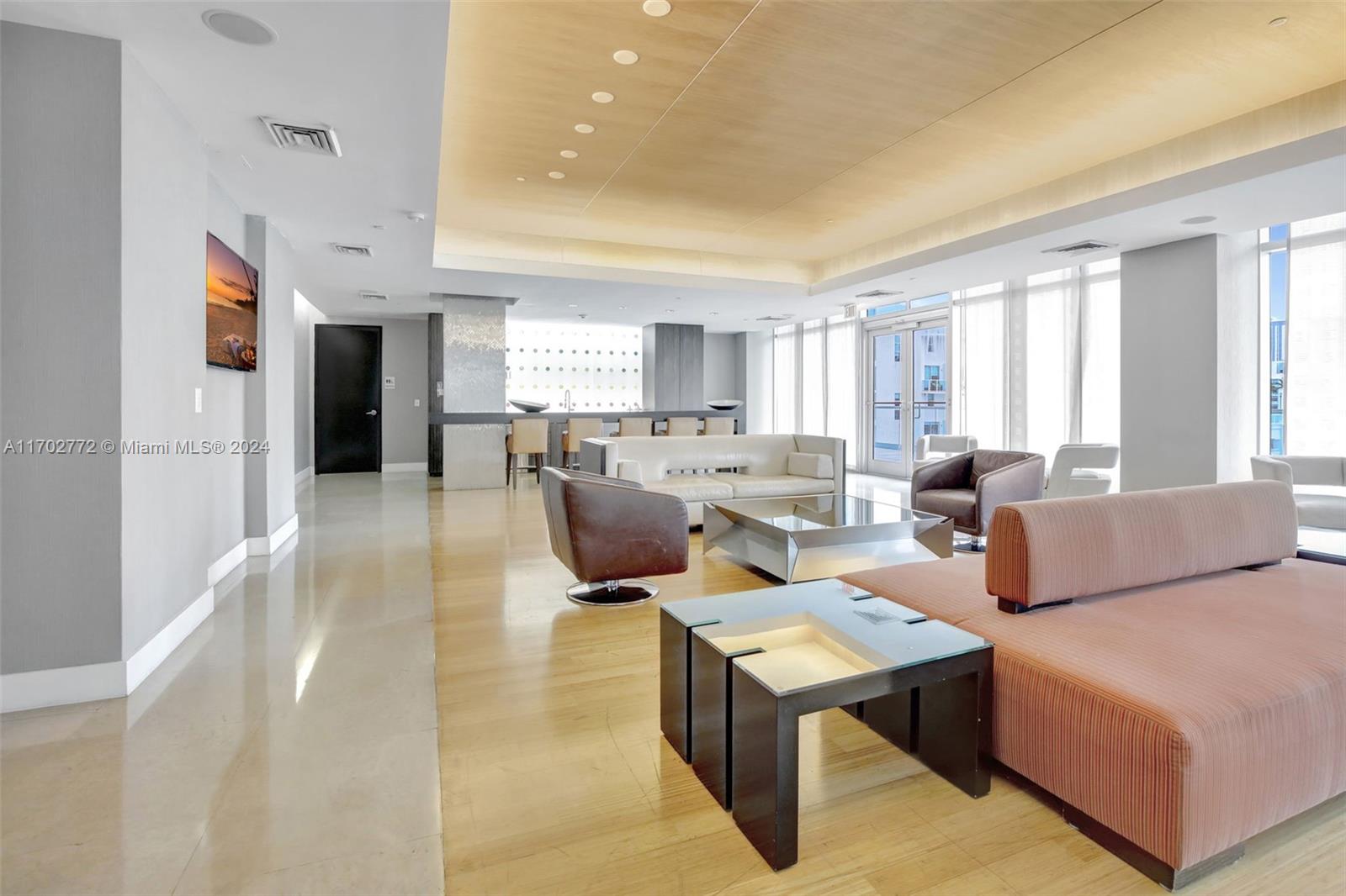 Brickell Miami, FL 33131 - Photo 42 of 52 a living room with lots of furniture and a large window