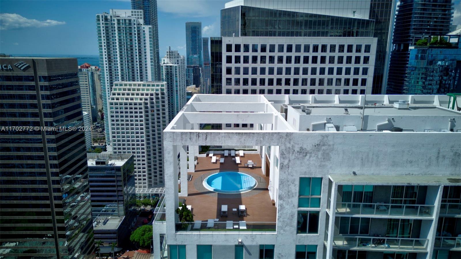 Brickell Miami, FL 33131 - Photo 48 of 52 a front view of a house with a garden
