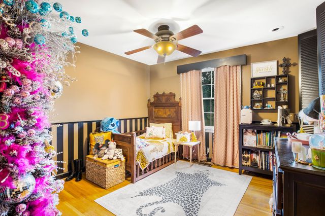 a bed room with a bed and a book shelf