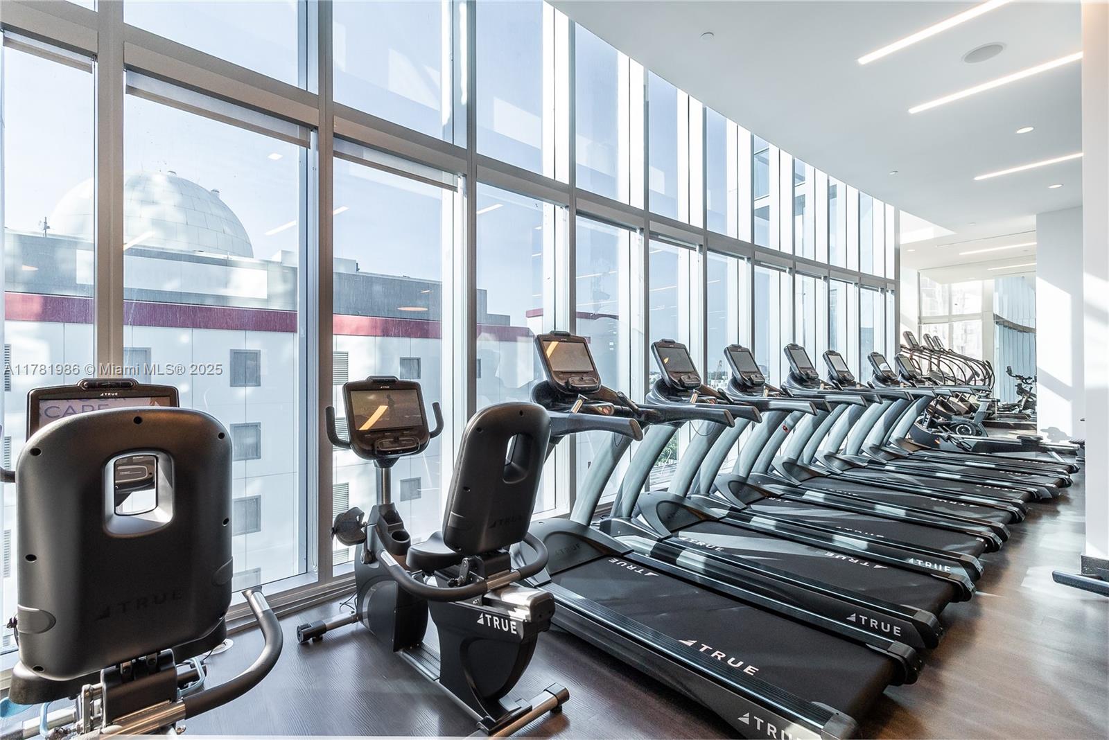 851 Northeast 1st Avenue, Unit 1102 Miami, FL 33132 - Photo 14 of 29 a view of a room with gym equipment