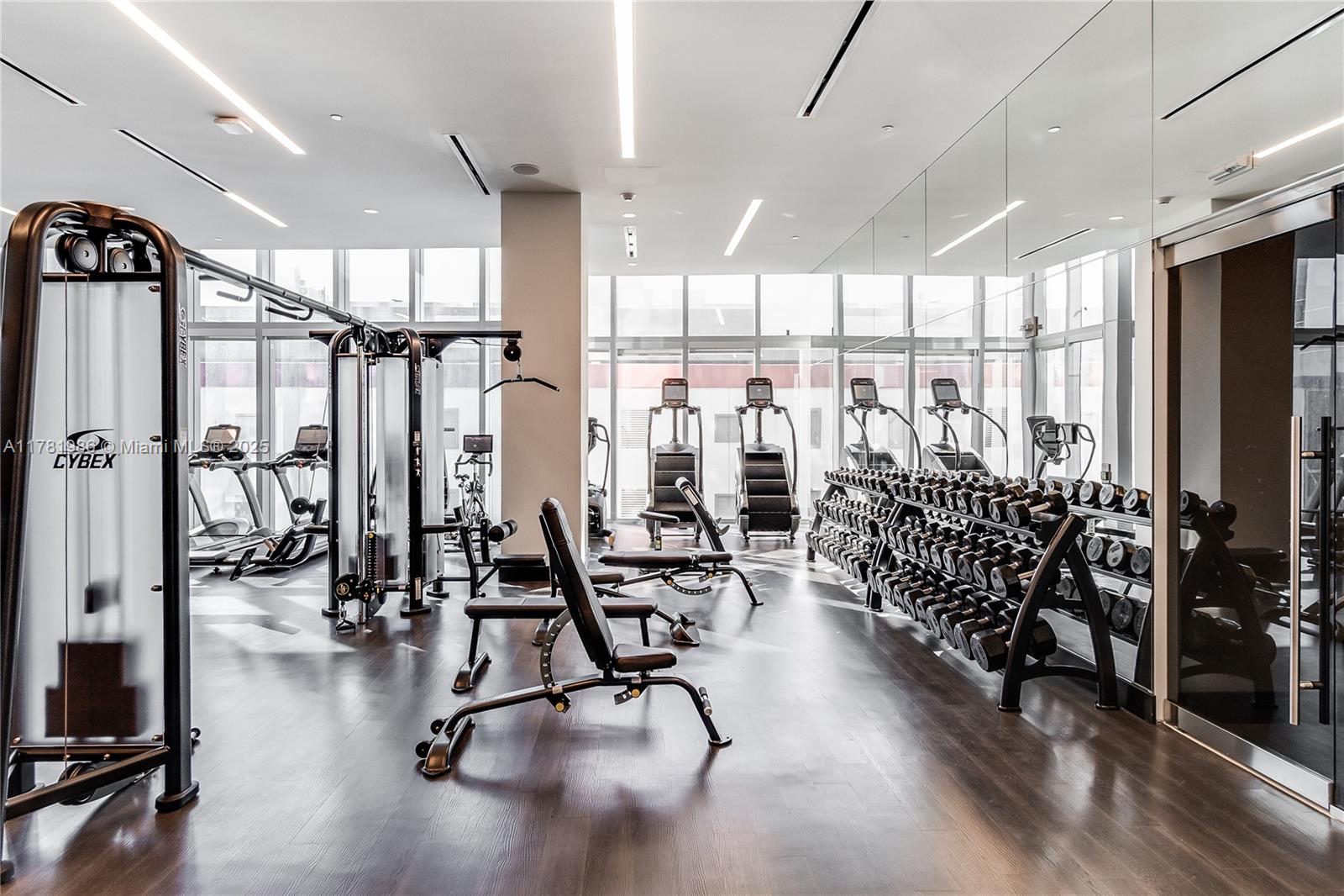 851 Northeast 1st Avenue, Unit 1102 Miami, FL 33132 - Photo 15 of 29 a view of a room with gym equipment