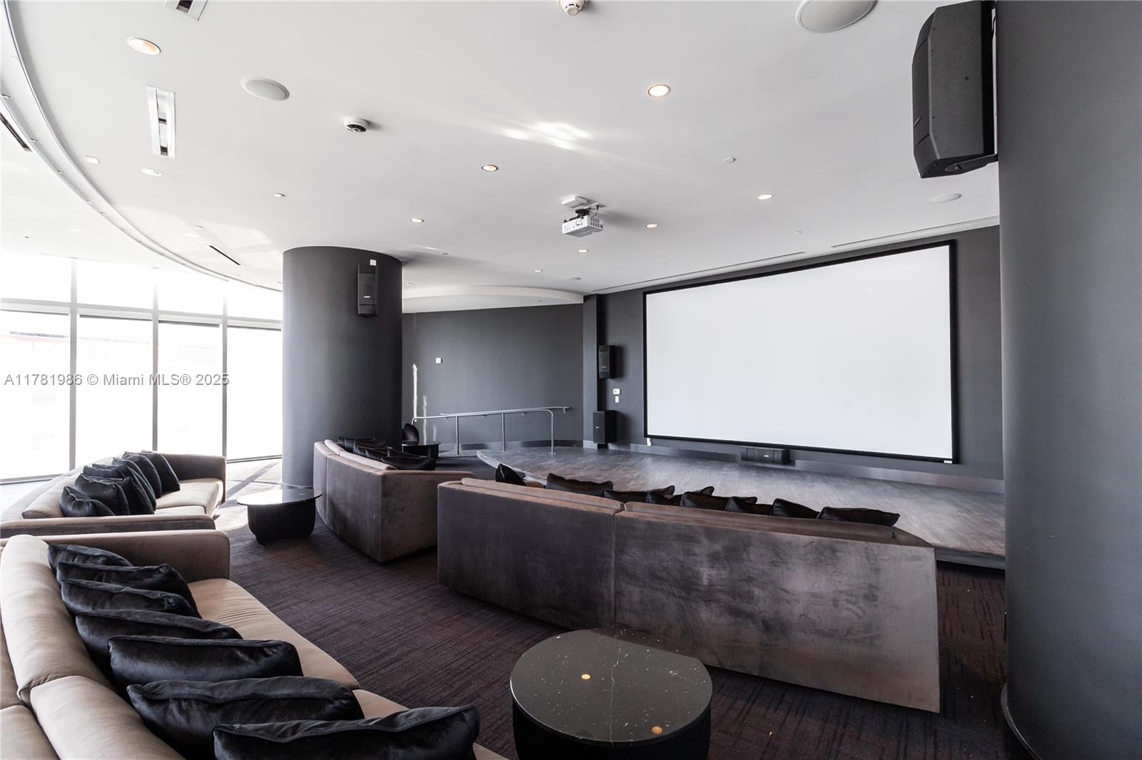 851 Northeast 1st Avenue, Unit 1102 Miami, FL 33132 - Photo 17 of 29 a living room with furniture and a flat screen tv