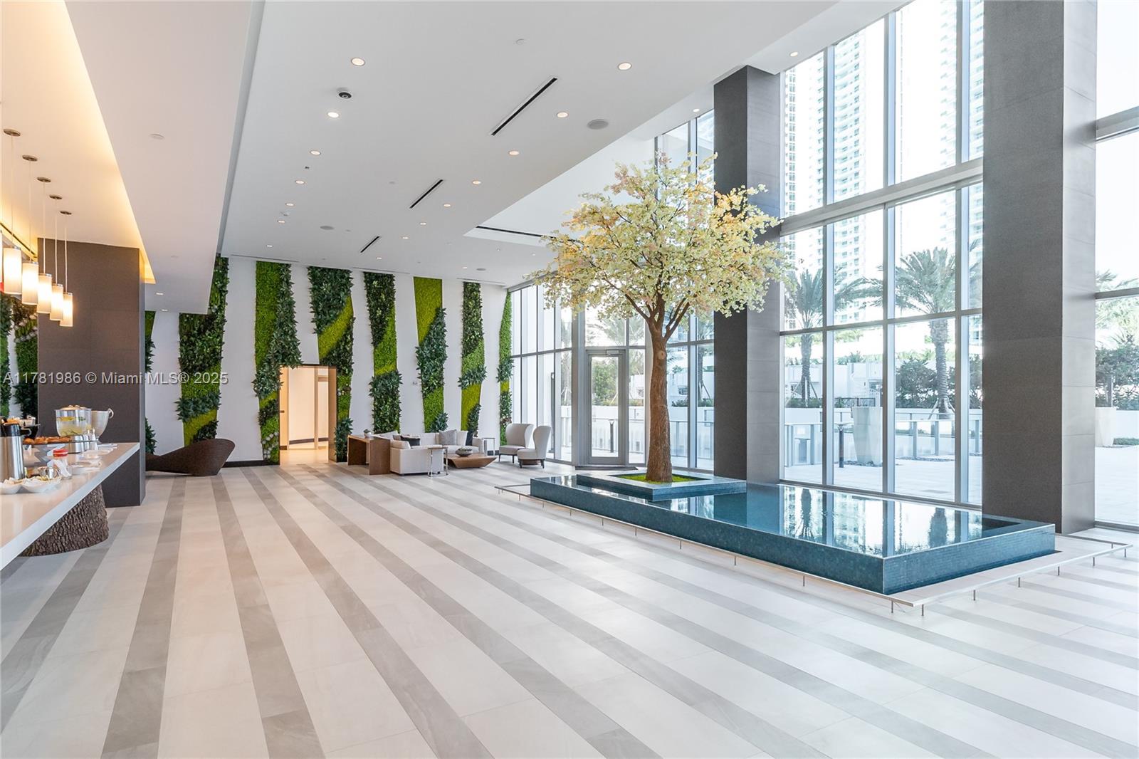 851 Northeast 1st Avenue, Unit 1102 Miami, FL 33132 - Photo 18 of 29 a view of staircase with large windows