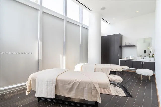 a bedroom with a bed and a lamp