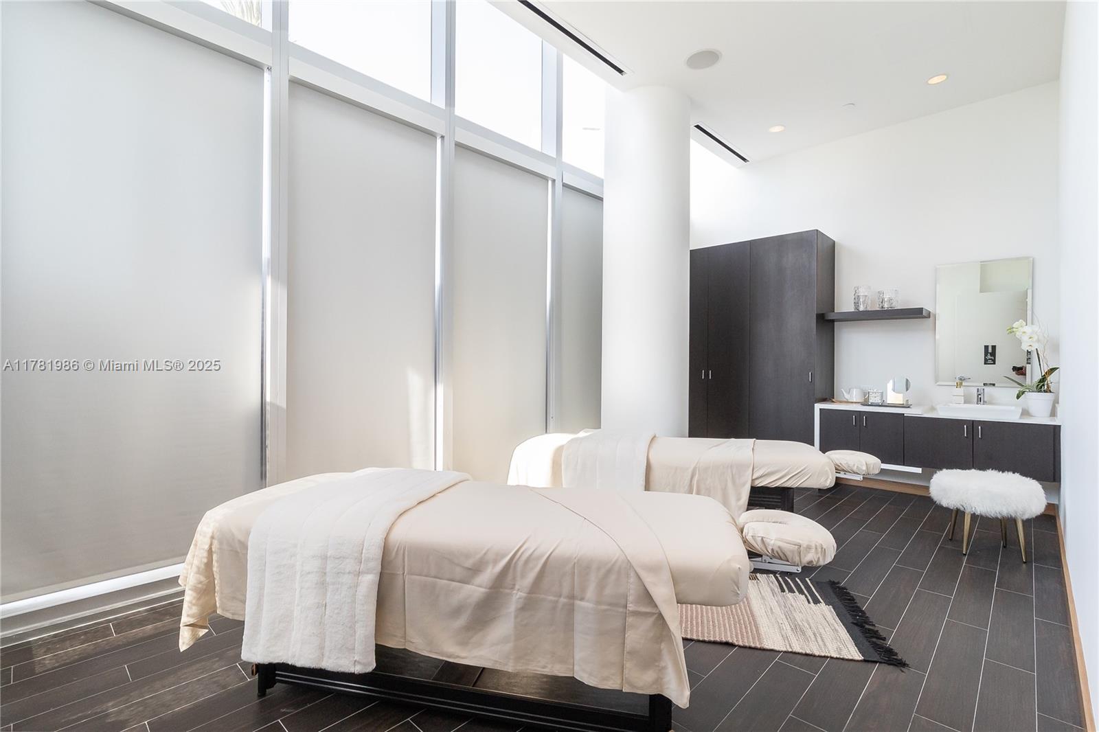 851 Northeast 1st Avenue, Unit 1102 Miami, FL 33132 - Photo 20 of 29 a bedroom with a bed and a lamp