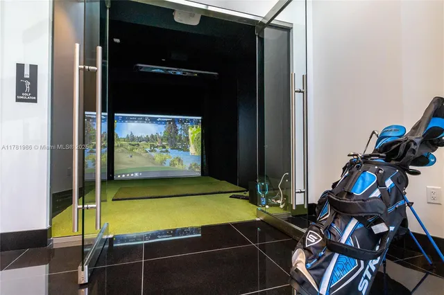 a room with gym equipment and glass door