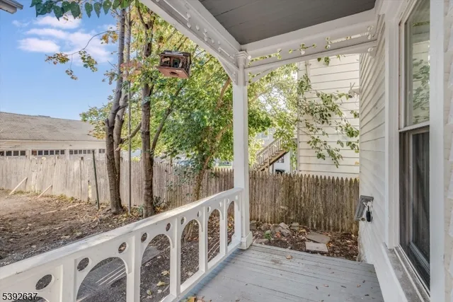 a view of balcony with wooden floor