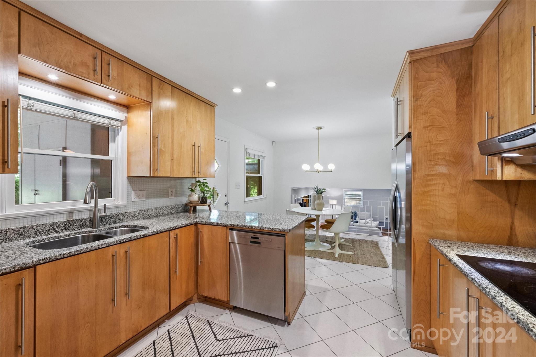 6810 Folger Drive Charlotte, NC 28270 - Photo 11 of 47 a kitchen with a sink a counter top space and cabinets