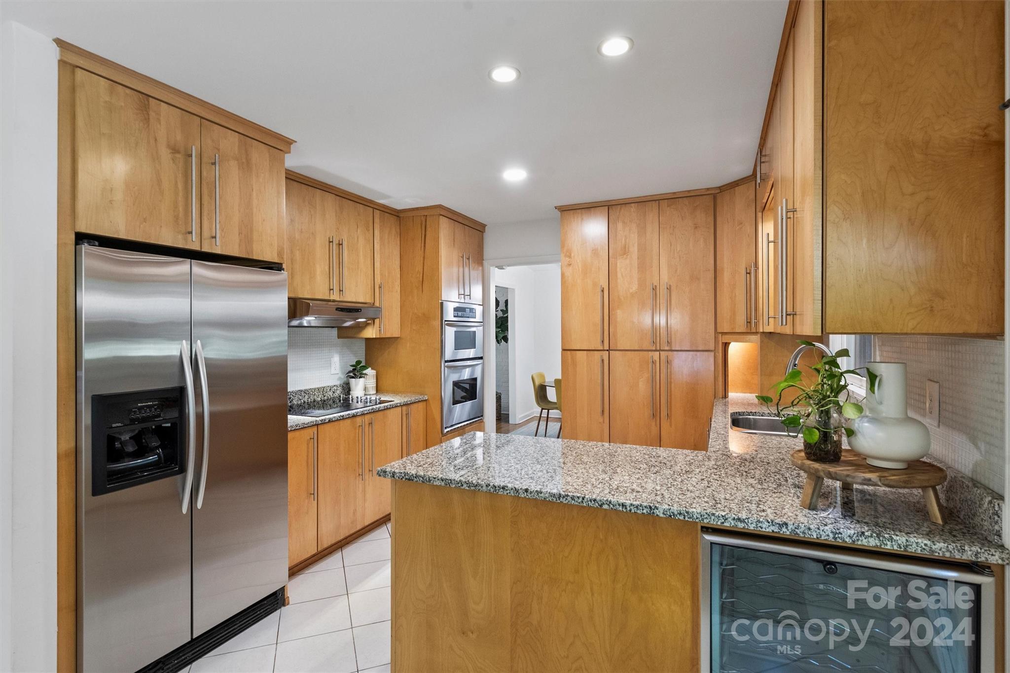 6810 Folger Drive Charlotte, NC 28270 - Photo 13 of 47 a kitchen with stainless steel appliances granite countertop a refrigerator a sink and a refrigerator