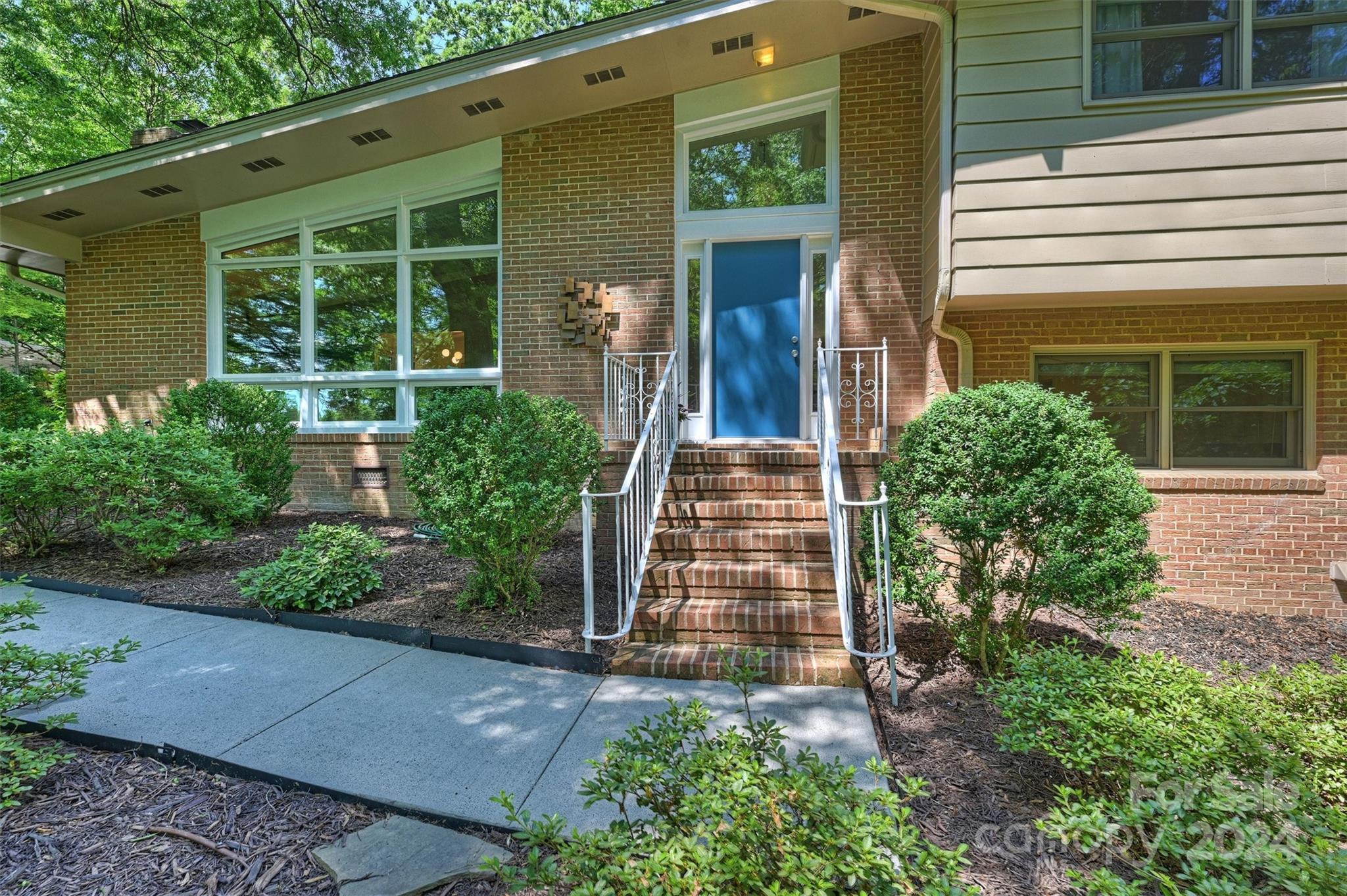 6810 Folger Drive Charlotte, NC 28270 - Photo 2 of 47 front view of a house with a yard