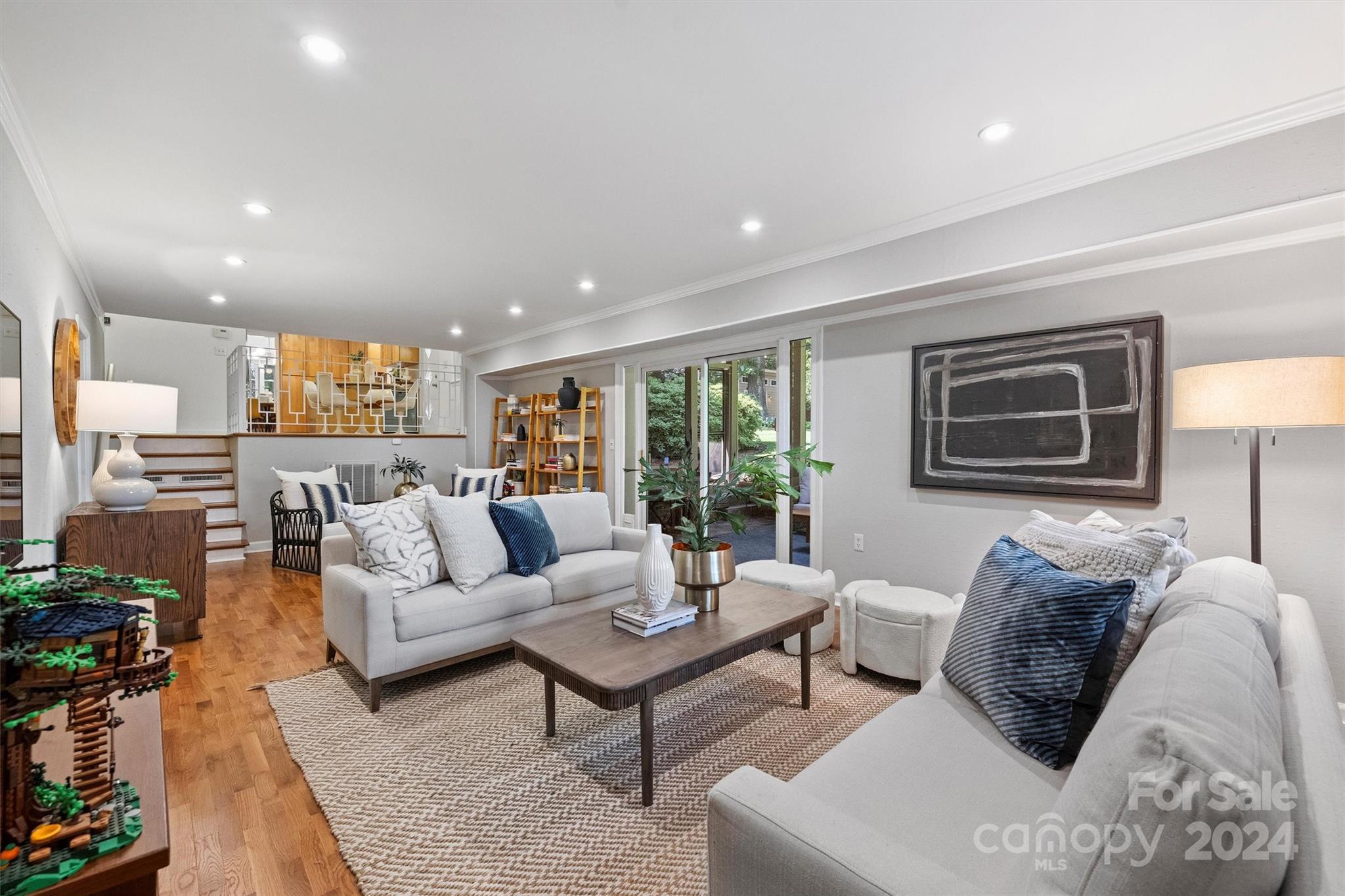 6810 Folger Drive Charlotte, NC 28270 - Photo 22 of 47 a living room with furniture and a lamp