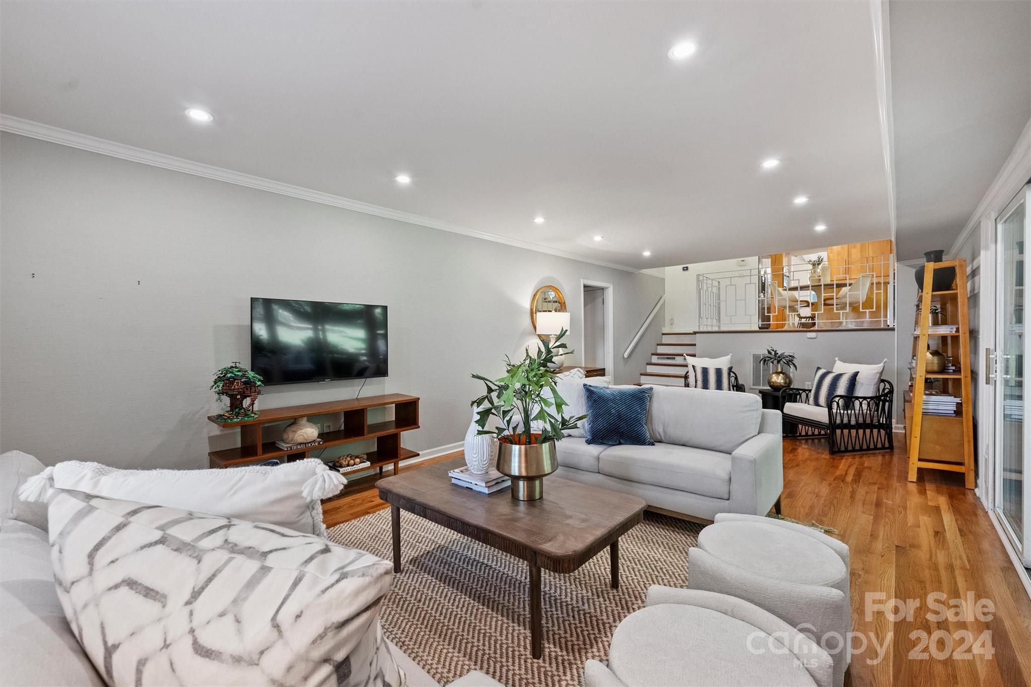 6810 Folger Drive Charlotte, NC 28270 - Photo 23 of 47 a living room with furniture and a flat screen tv