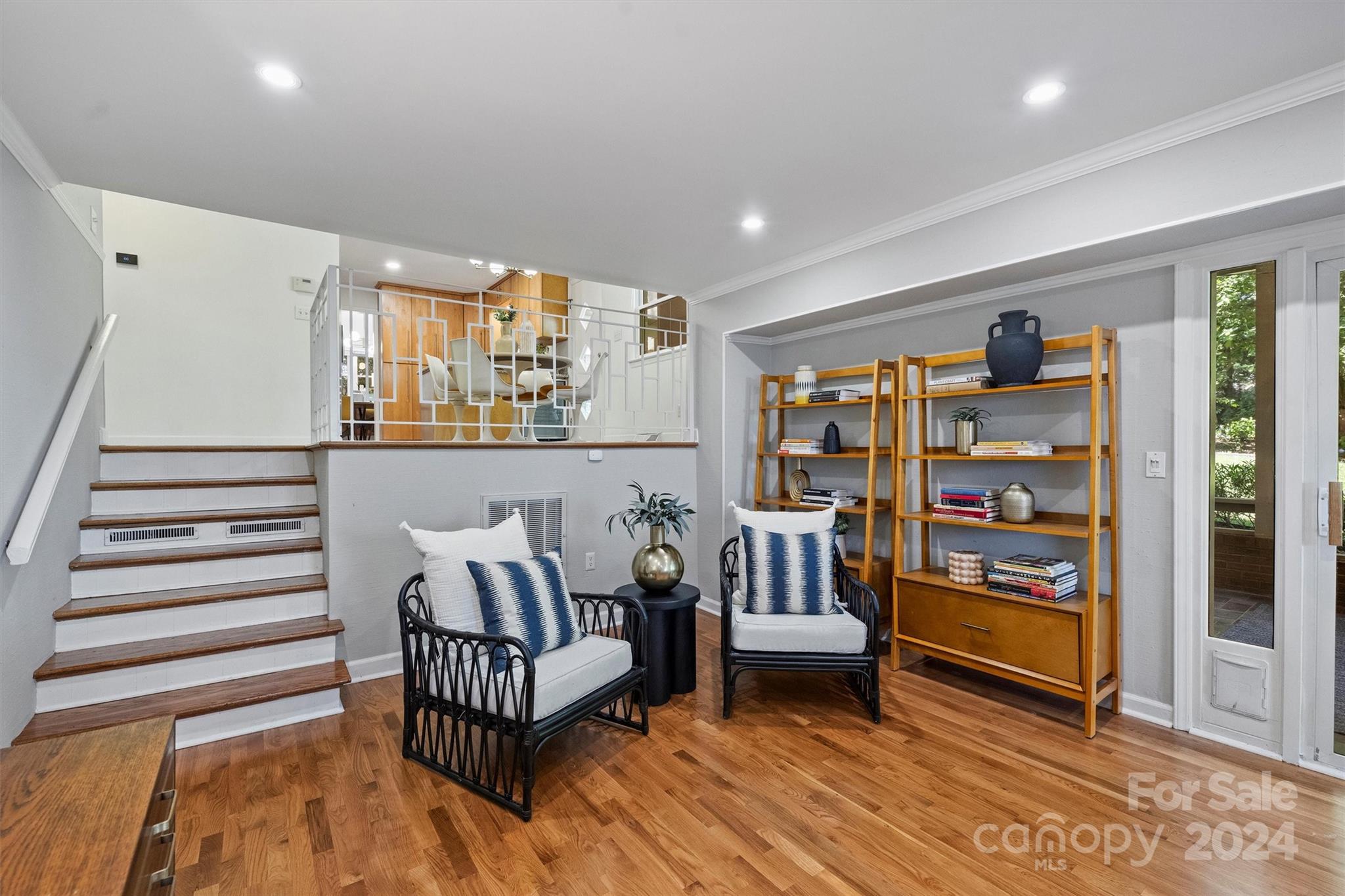 6810 Folger Drive Charlotte, NC 28270 - Photo 24 of 47 a living room with furniture and a book shelf