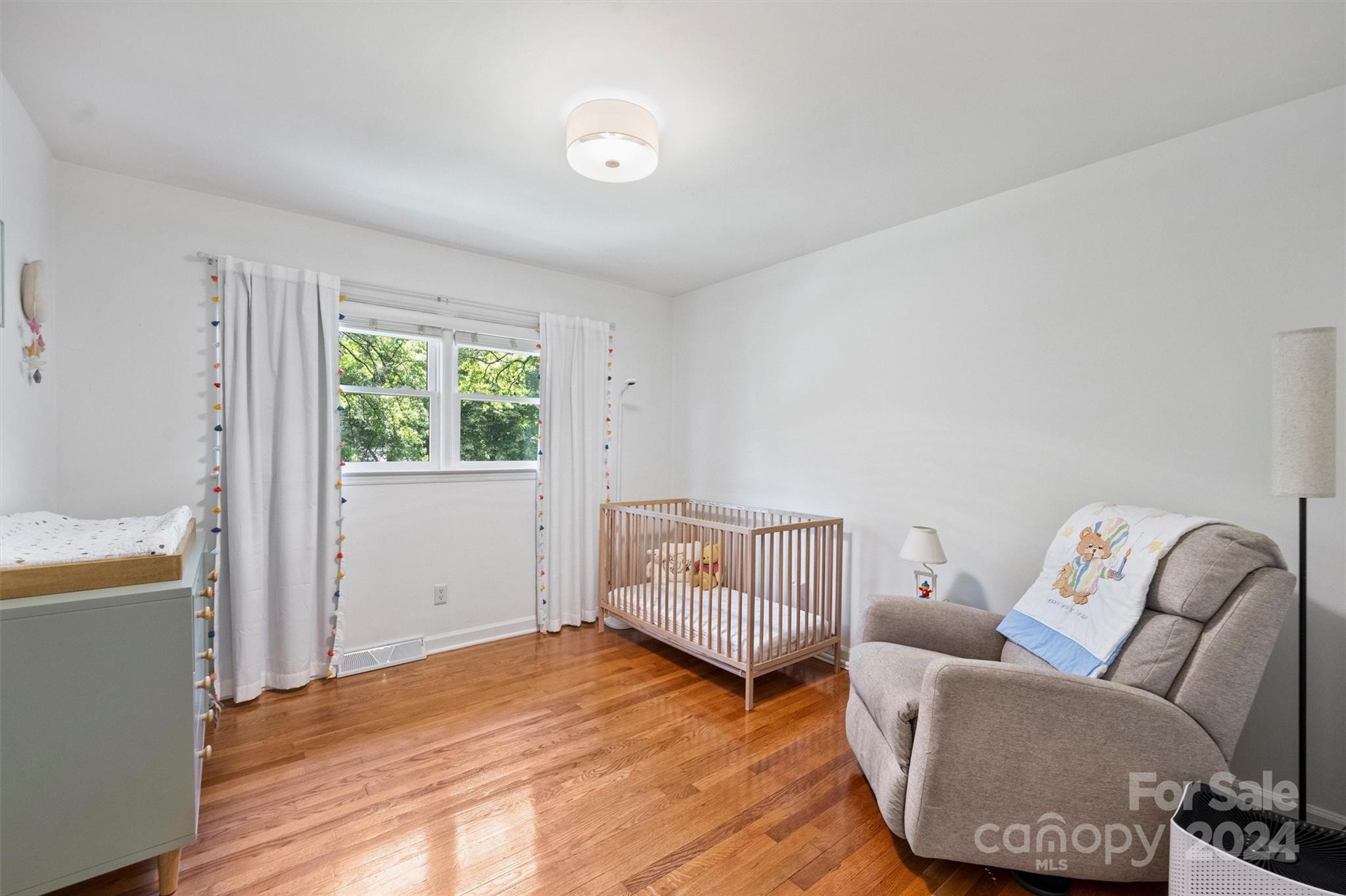 6810 Folger Drive Charlotte, NC 28270 - Photo 30 of 47 a bedroom with furniture and wooden floor