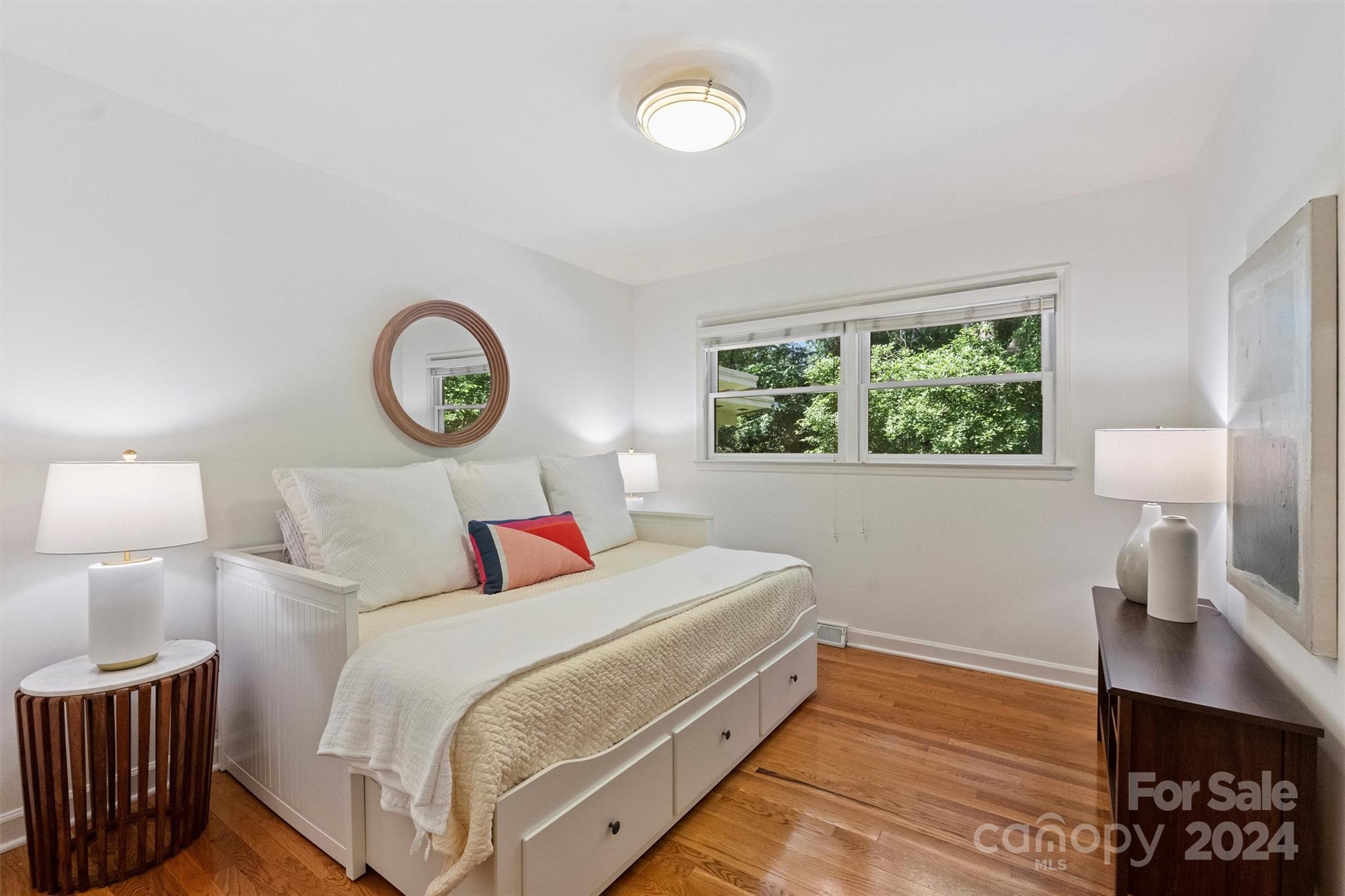 6810 Folger Drive Charlotte, NC 28270 - Photo 31 of 47 a bedroom with a bed and a lamp