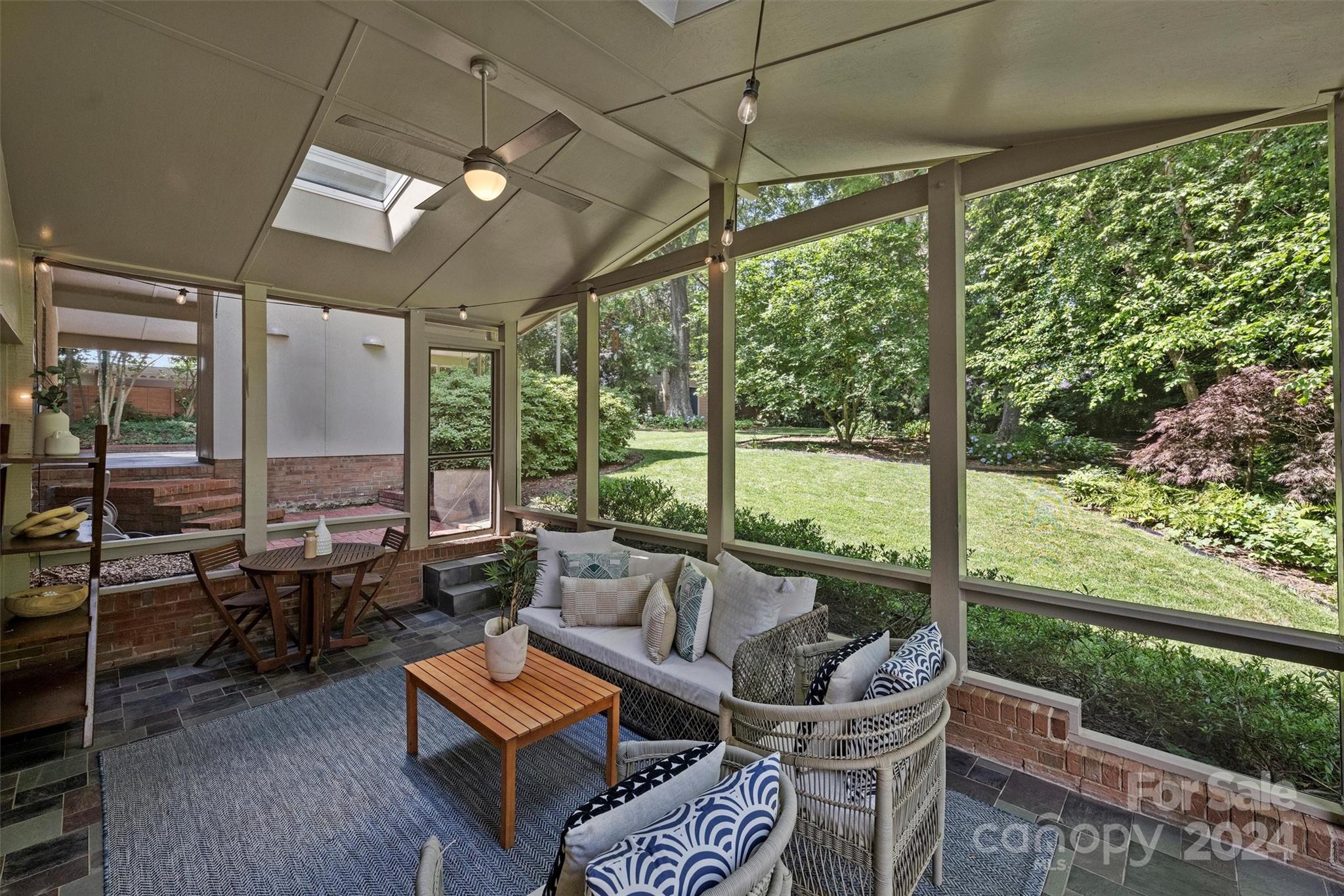 6810 Folger Drive Charlotte, NC 28270 - Photo 33 of 47 a living room with furniture and a floor to ceiling window