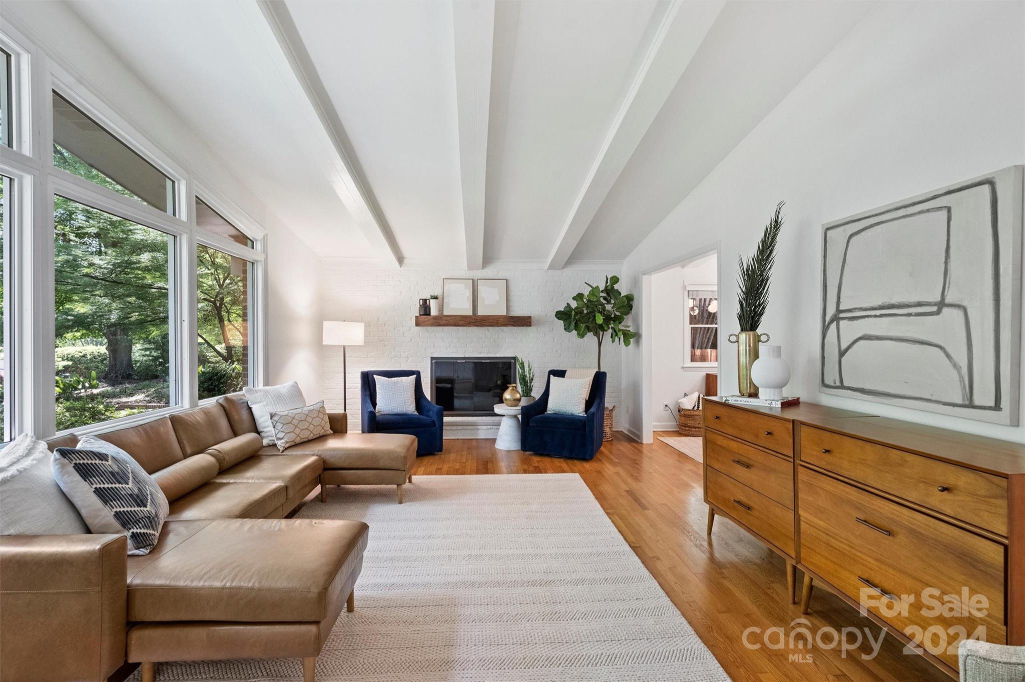 6810 Folger Drive Charlotte, NC 28270 - Photo 4 of 47 a living room with furniture fireplace and flat screen tv