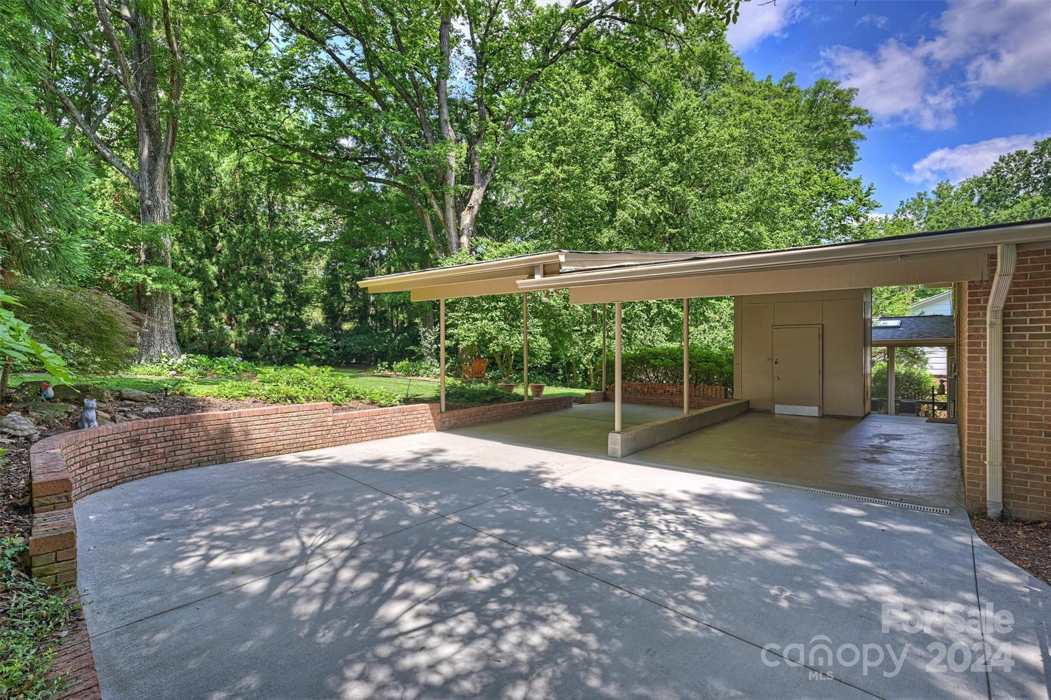 6810 Folger Drive Charlotte, NC 28270 - Photo 42 of 47 a view of a yard with porch and wooden fence