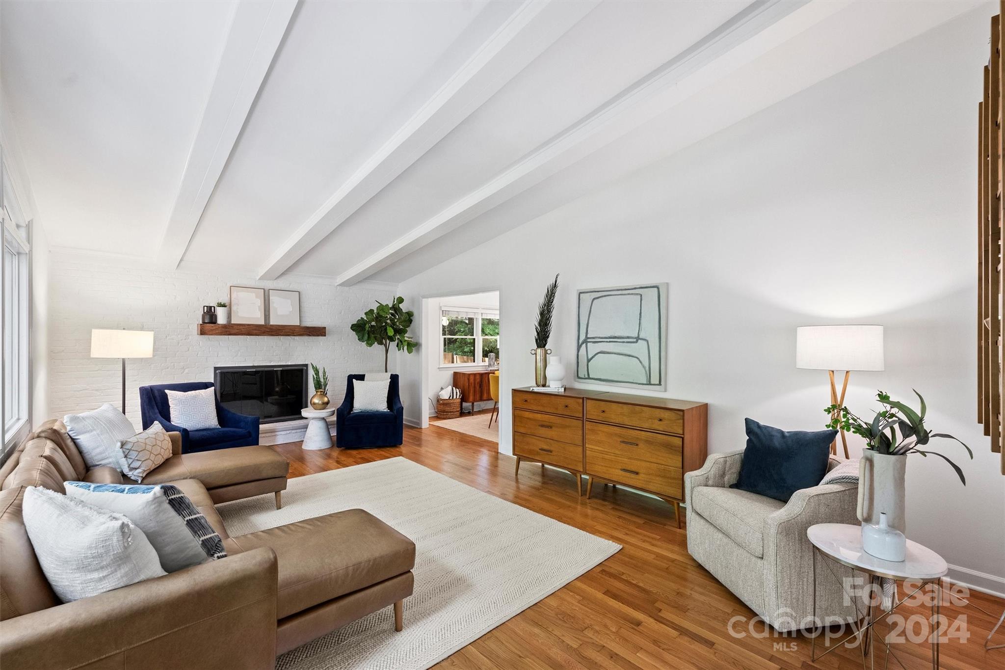 6810 Folger Drive Charlotte, NC 28270 - Photo 5 of 47 a living room with furniture and a fireplace