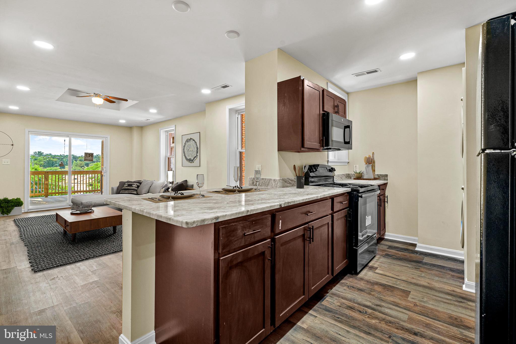 948 Brooks Lane Baltimore, MD 21217 - Photo 9 of 24 Kitchen/Living Room Staged