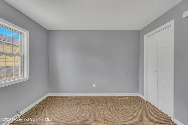 an empty room with windows