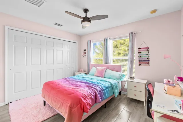 a bed room with a bed and a window