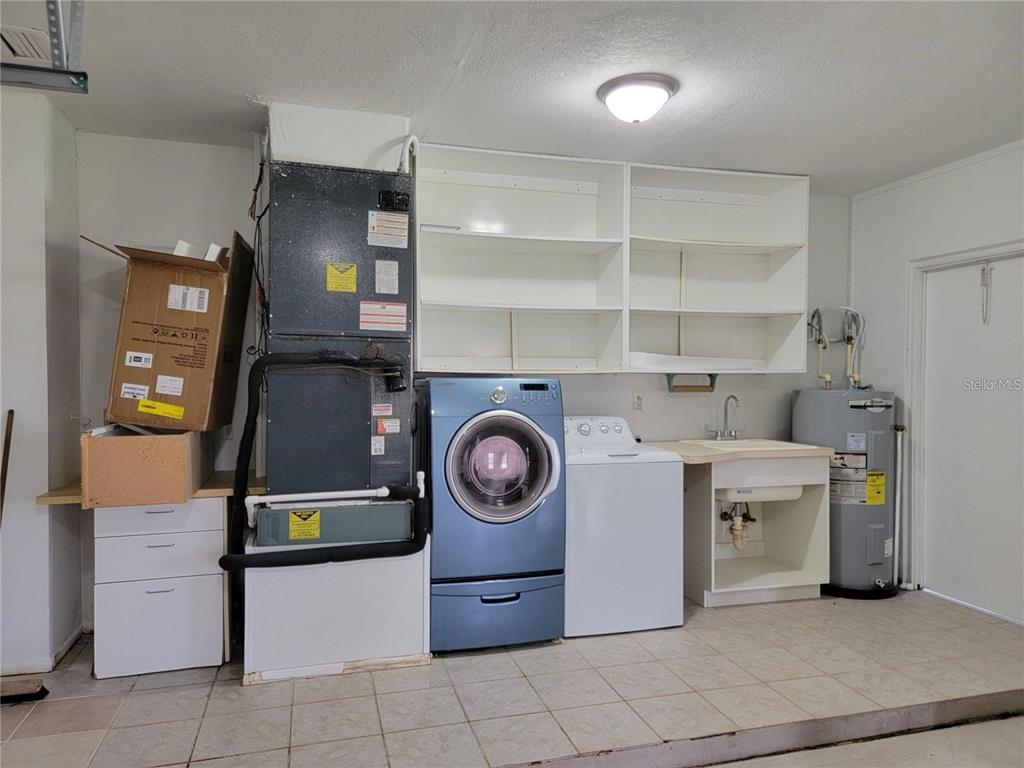 26221 Constantine Road Punta Gorda, FL 33983 - Photo 24 of 27 a utility room with dryer and washer