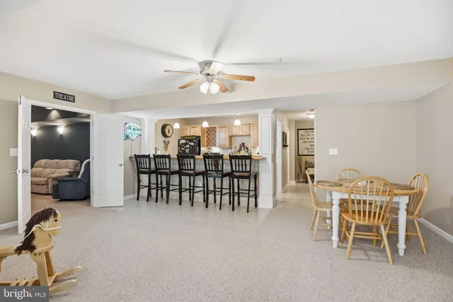a living room with furniture and a gym equipment