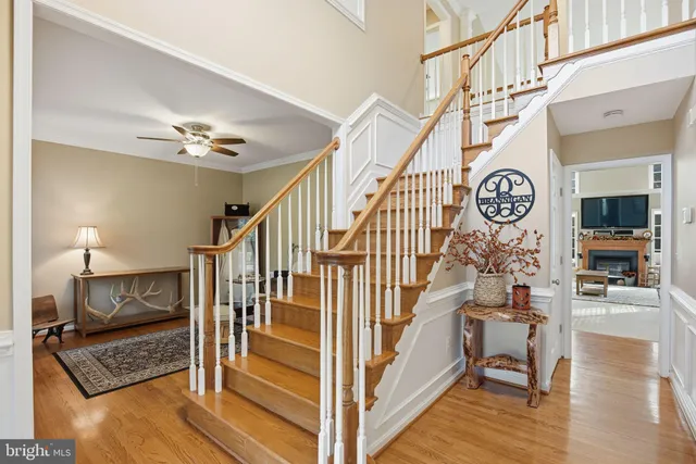 a view of entryway livingroom and hall with wooden floor