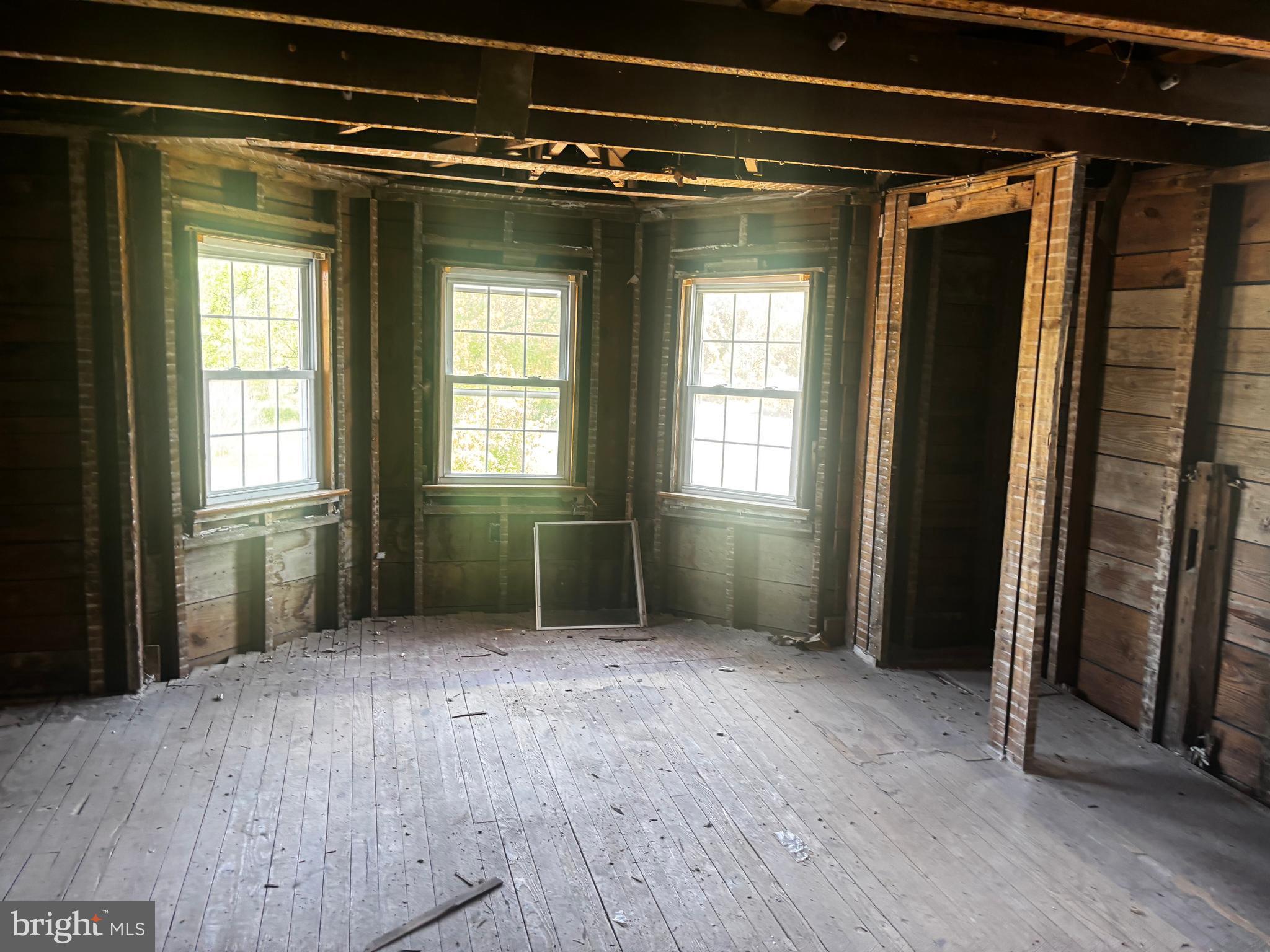 219 Pump Branch Road Waterford Works, NJ 08089 - Photo 34 of 35 an empty room with wooden floor and a window