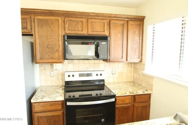 a view of a refrigerator in kitchen and a refrigerator