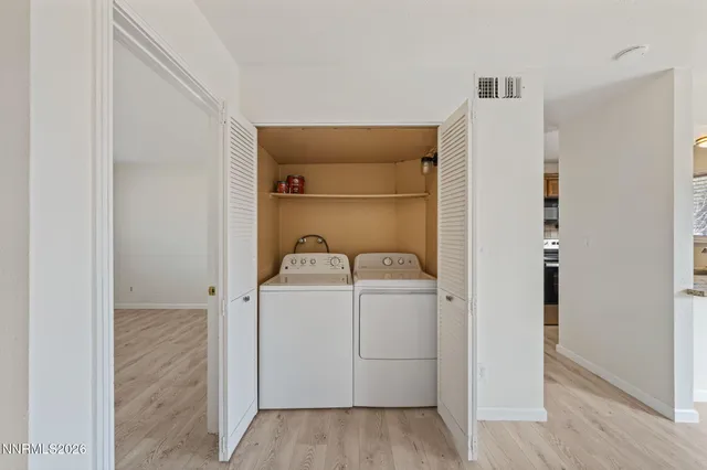 a view of storage and utility room with closet
