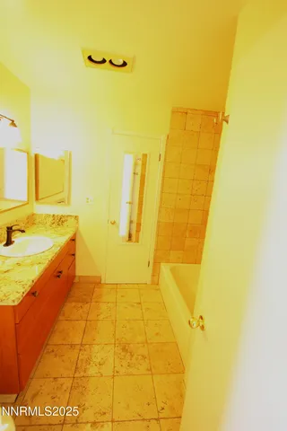 a kitchen with granite countertop cabinets stainless steel appliances and a counter space