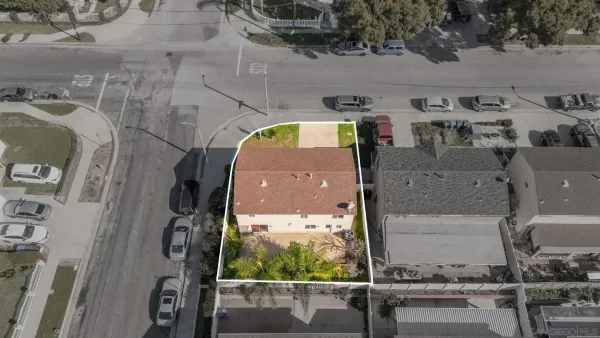 an aerial view of residential house with outdoor space and swimming pool