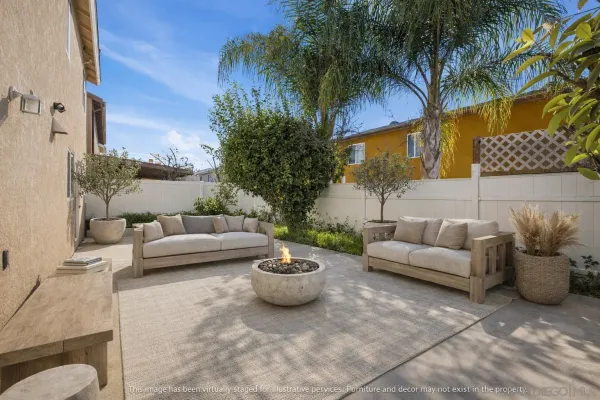 a view of a patio with couches and a potted plant