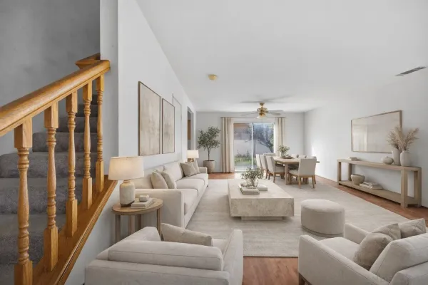 a view of hallway with wooden floor and chandelier