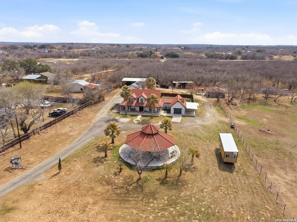an aerial view of residential houses with outdoor space