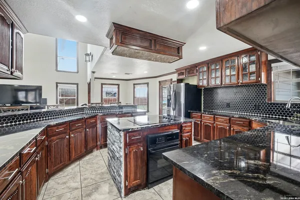 a bedroom with a bed and a television