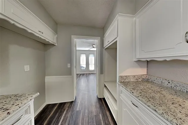 a view of a kitchen from the hallway
