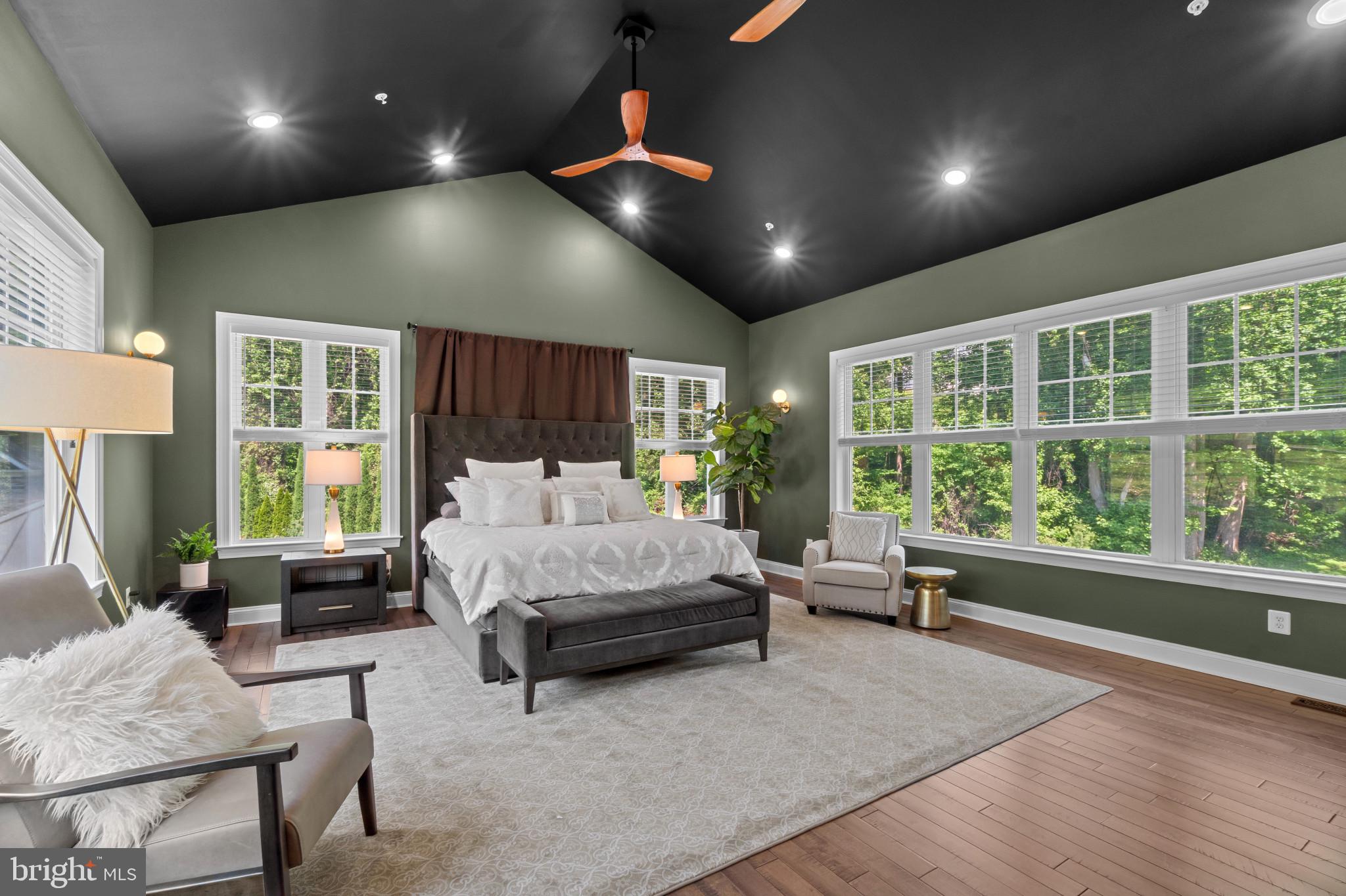 10907 Hollow Road Cockeysville, MD 21030 - Photo 29 of 57 a spacious bedroom with a bed couch and a large window